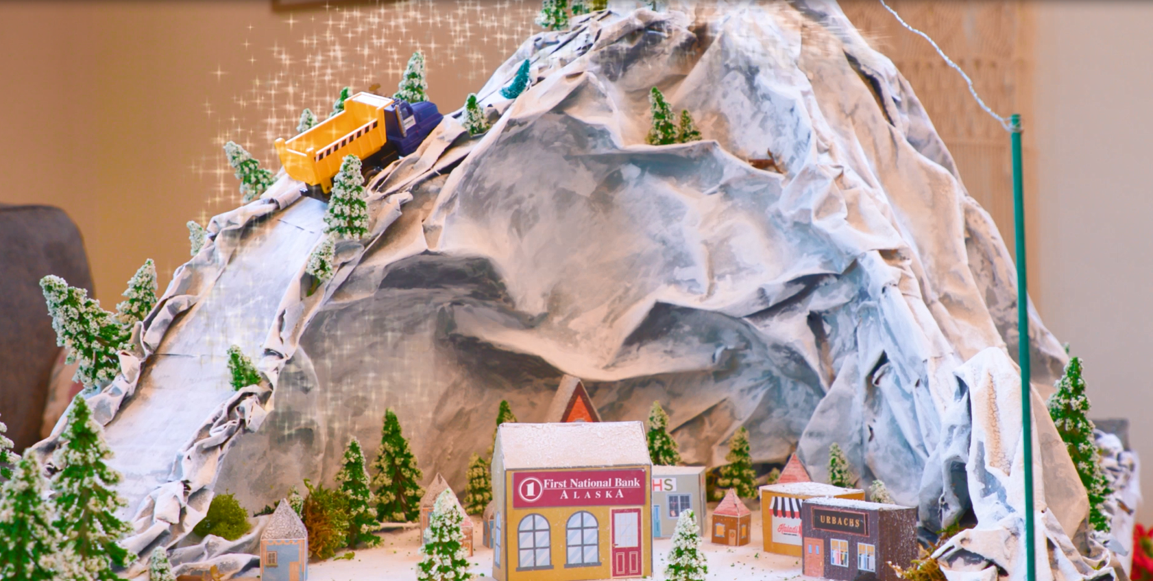 Holiday village scene with First National and local businesses