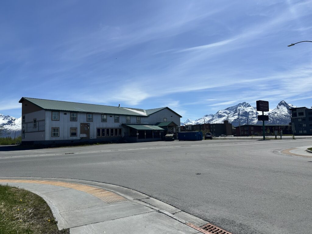 Photo of Mountain Sky Hotel in Valdez with mountains in background.